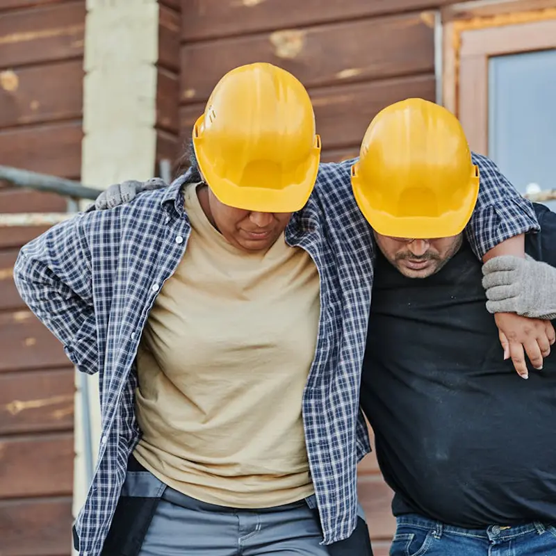 Construction worker helps an injured colleague return to work